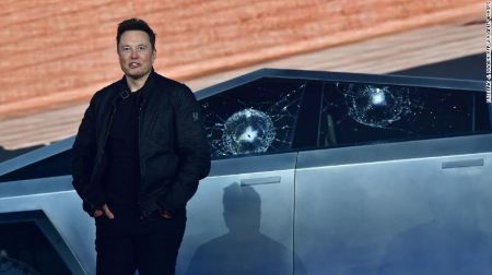 Elon Musk looking on embarrassed